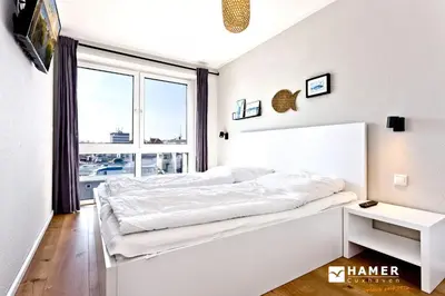 Ein Bett oder Betten in einem Zimmer der Unterkunft City Marina, CM16b