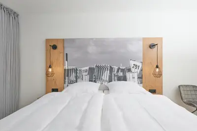 Ein Bett oder Betten in einem Zimmer der Unterkunft Nordstrand, N202