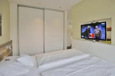 Ein Bett oder Betten in einem Zimmer der Unterkunft Duhner Strandhus, S101