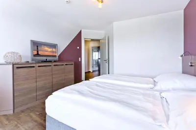 Ein Bett oder Betten in einem Zimmer der Unterkunft Residenz am Yachthafen, RY9