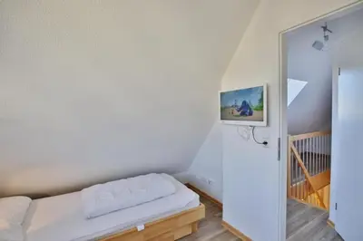 Ein Bett oder Betten in einem Zimmer der Unterkunft Ruge Bries, RB9