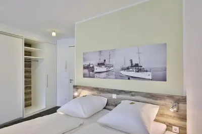 Ein Bett oder Betten in einem Zimmer der Unterkunft Duhner Strandhus, S306