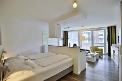 Ein Bett oder Betten in einem Zimmer der Unterkunft Duhner Strandhus, S106