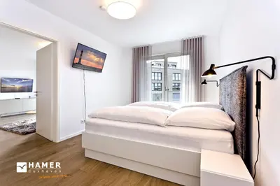 Ein Bett oder Betten in einem Zimmer der Unterkunft Duhner Spitze, DS61