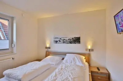 Ein Bett oder Betten in einem Zimmer der Unterkunft Ruge Bries, RB4