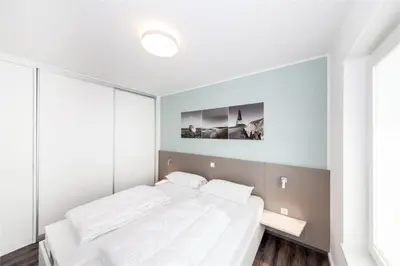Ein Bett oder Betten in einem Zimmer der Unterkunft Duhner Brandung, B8