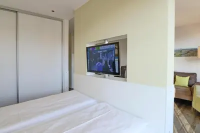 Ein Bett oder Betten in einem Zimmer der Unterkunft Duhner Strandhus, S303