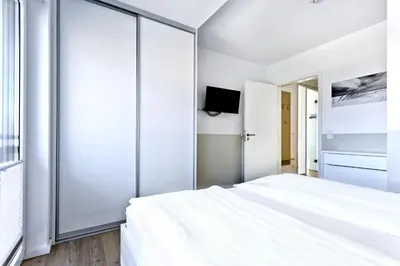 Ein Bett oder Betten in einem Zimmer der Unterkunft Duhner Brandung, B12