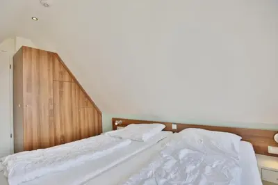Ein Bett oder Betten in einem Zimmer der Unterkunft Wattwagen, RW5
