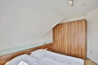 Ein Bett oder Betten in einem Zimmer der Unterkunft Wattwagen, RW5