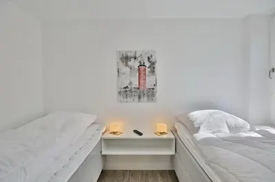 Ein Bett oder Betten in einem Zimmer der Unterkunft Hohe Worth, H12