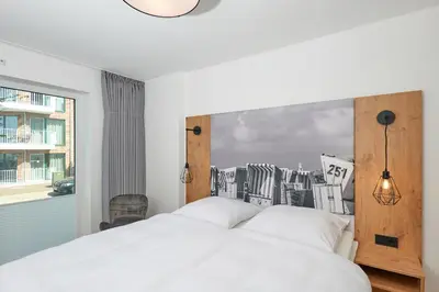 Ein Bett oder Betten in einem Zimmer der Unterkunft Nordstrand, N104