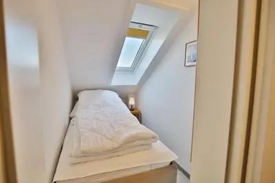 Ein Bett oder Betten in einem Zimmer der Unterkunft Hohe Worth, H411