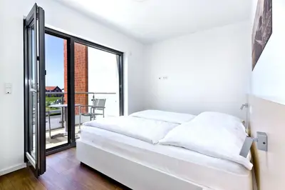 Ein Bett oder Betten in einem Zimmer der Unterkunft Alte Liebe, RA208