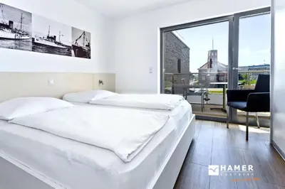 Ein Bett oder Betten in einem Zimmer der Unterkunft Alte Liebe, RA208
