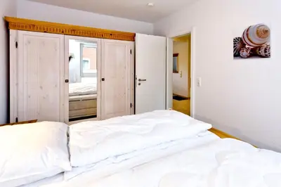 Ein Bett oder Betten in einem Zimmer der Unterkunft Rugenbarg, RR6