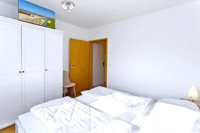 Ein Bett oder Betten in einem Zimmer der Unterkunft Aquaris, AQ7