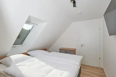 Ein Bett oder Betten in einem Zimmer der Unterkunft Nordstrand, N301a