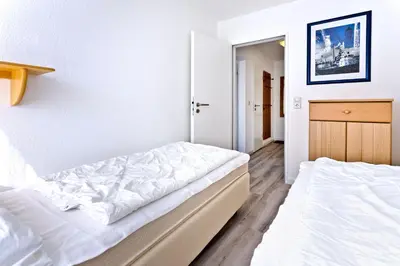 Ein Bett oder Betten in einem Zimmer der Unterkunft Hohe Worth, H412
