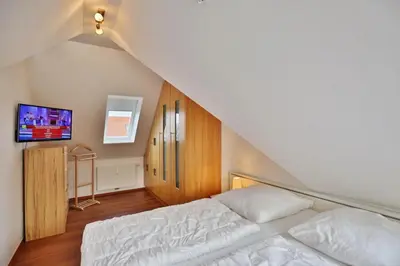 Ein Bett oder Betten in einem Zimmer der Unterkunft Bernstein, BS6