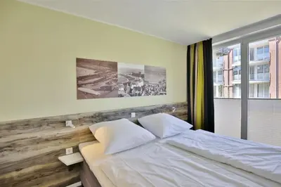 Ein Bett oder Betten in einem Zimmer der Unterkunft Duhner Strandhus, S104