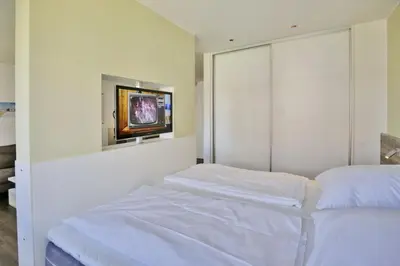 Ein Bett oder Betten in einem Zimmer der Unterkunft Duhner Strandhus, S104