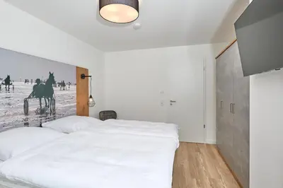 Ein Bett oder Betten in einem Zimmer der Unterkunft Nordstrand, N203