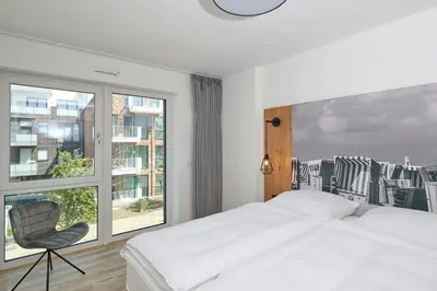 Ein Bett oder Betten in einem Zimmer der Unterkunft Nordstrand, N203