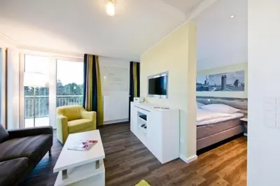 Ein Bett oder Betten in einem Zimmer der Unterkunft Duhner Strandhus, S301