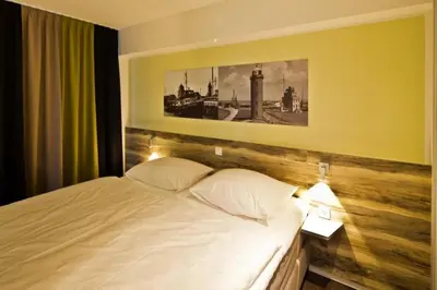 Ein Bett oder Betten in einem Zimmer der Unterkunft Duhner Strandhus, S301