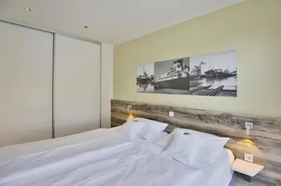 Ein Bett oder Betten in einem Zimmer der Unterkunft Duhner Strandhus, S4
