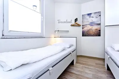 Ein Bett oder Betten in einem Zimmer der Unterkunft Seeterrassen, ST17