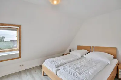 Ein Bett oder Betten in einem Zimmer der Unterkunft Stranddüne, D20