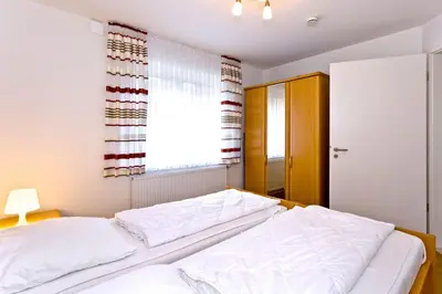 Ein Bett oder Betten in einem Zimmer der Unterkunft Ruge Bries, RB3
