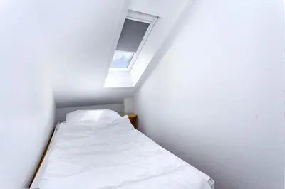 Ein Bett oder Betten in einem Zimmer der Unterkunft Hohe Worth, H405