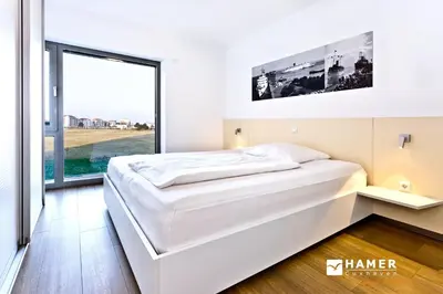 Ein Bett oder Betten in einem Zimmer der Unterkunft Alte Liebe, RA306