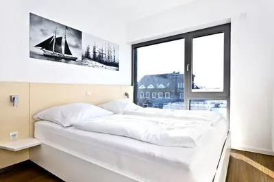 Ein Bett oder Betten in einem Zimmer der Unterkunft Alte Liebe, RA305