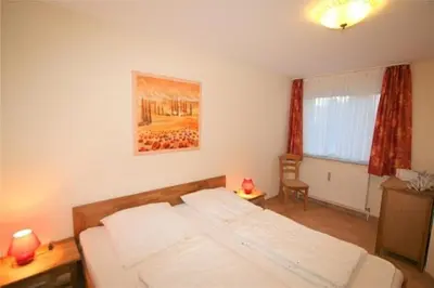 Ein Bett oder Betten in einem Zimmer der Unterkunft Stranddüne, D19