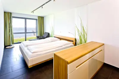 Ein Bett oder Betten in einem Zimmer der Unterkunft Residenz am Yachthafen, RY17