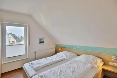 Ein Bett oder Betten in einem Zimmer der Unterkunft Wattwagen, RW6