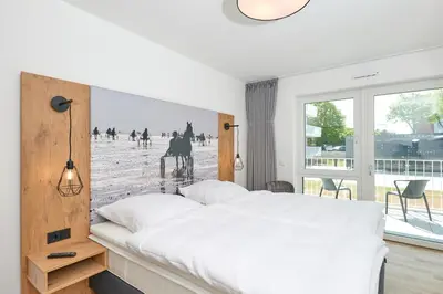 Ein Bett oder Betten in einem Zimmer der Unterkunft Nordstrand, N101