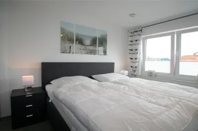 Ein Bett oder Betten in einem Zimmer der Unterkunft Admiralsgarten, AG8b