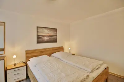 Ein Bett oder Betten in einem Zimmer der Unterkunft Stranddüne, D1