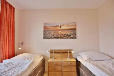 Ein Bett oder Betten in einem Zimmer der Unterkunft Hohe Worth, H306