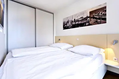 Ein Bett oder Betten in einem Zimmer der Unterkunft Alte Liebe, RA111