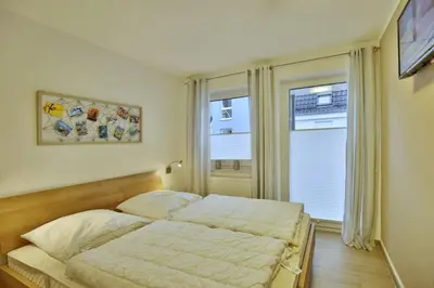 Ein Bett oder Betten in einem Zimmer der Unterkunft Ruge Bries, RB5