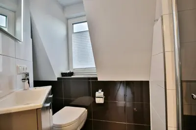 Ein Badezimmer in der Unterkunft Dünenweg 37, DW5