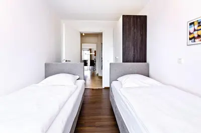 Ein Bett oder Betten in einem Zimmer der Unterkunft Residenz am Yachthafen, RY10