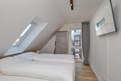 Ein Bett oder Betten in einem Zimmer der Unterkunft Nordstrand, N302a