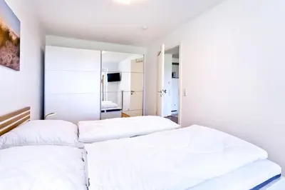 Ein Bett oder Betten in einem Zimmer der Unterkunft Strandpalais, SP405